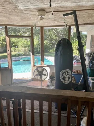 a view of house with wooden floor and windows