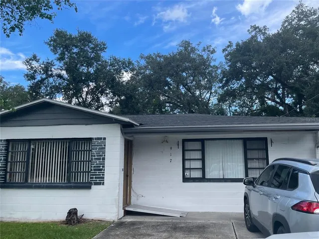 a house with trees in the background