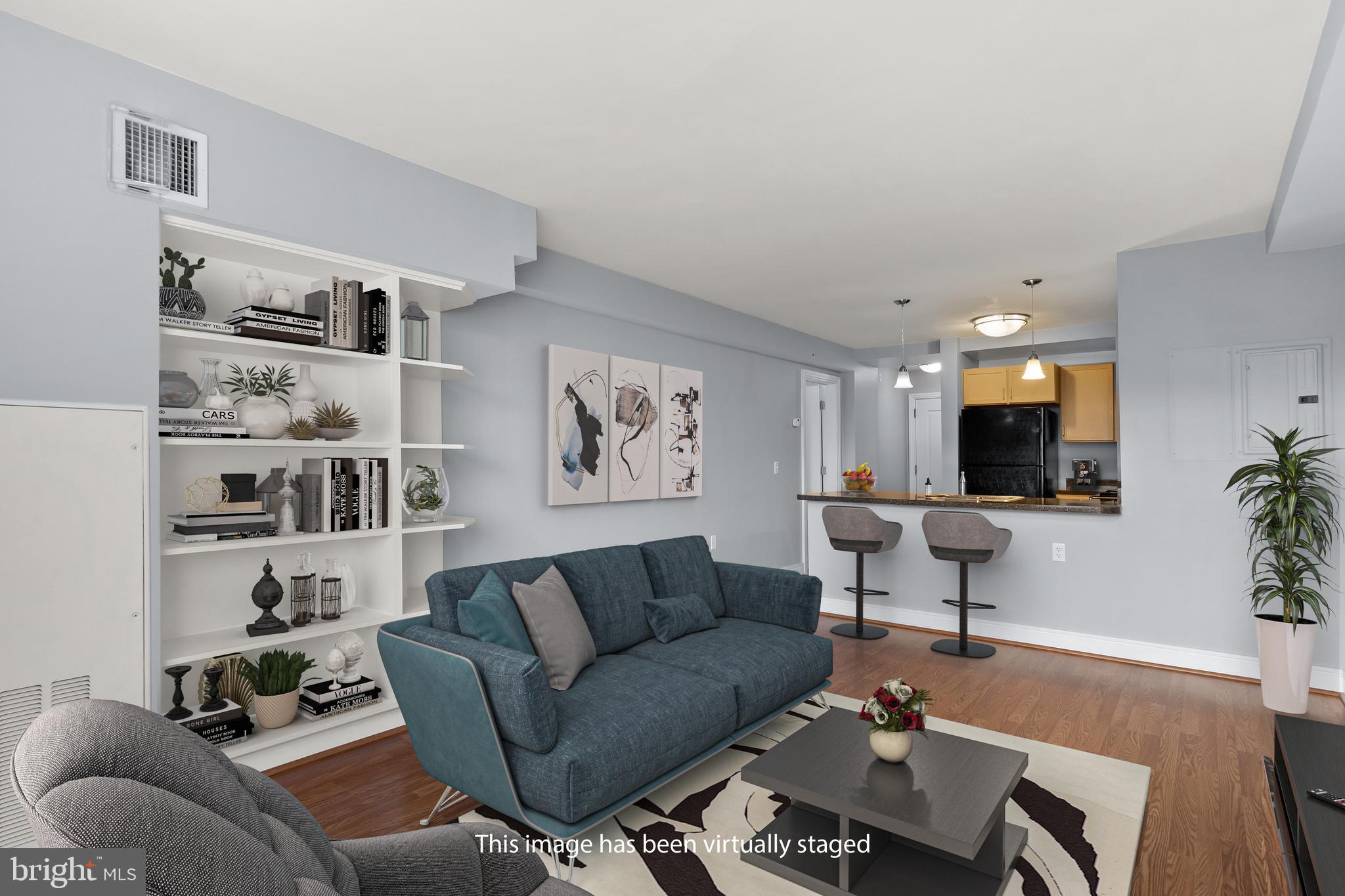 800 4th Street Southwest, Unit S312 Washington, DC 20024 - Photo 10 of 42 Living Rm with Built-in shelving & wood floors.