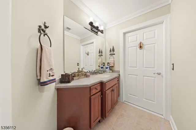 a bathroom with a double vanity sink a mirror and a shower