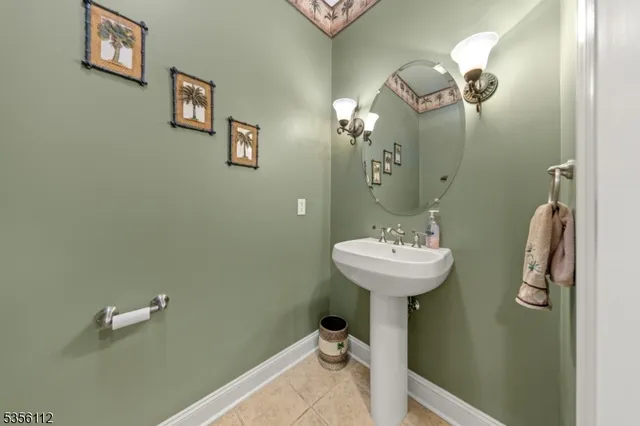 a bathroom with a sink and mirror