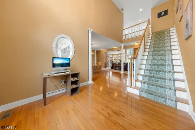 a view of a livingroom with furniture and wooden floor