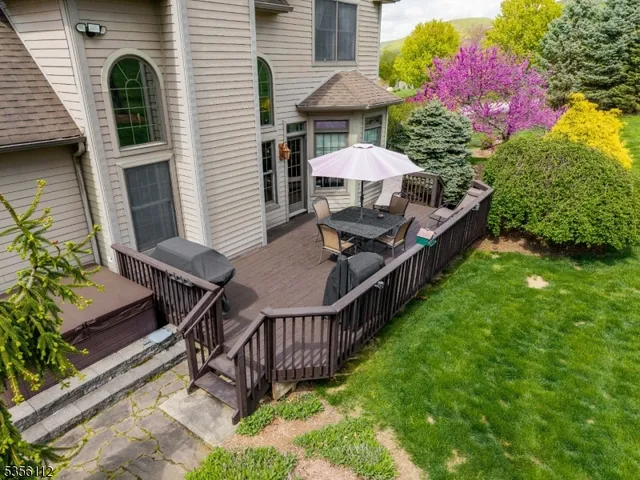 a backyard of a house with table and chairs