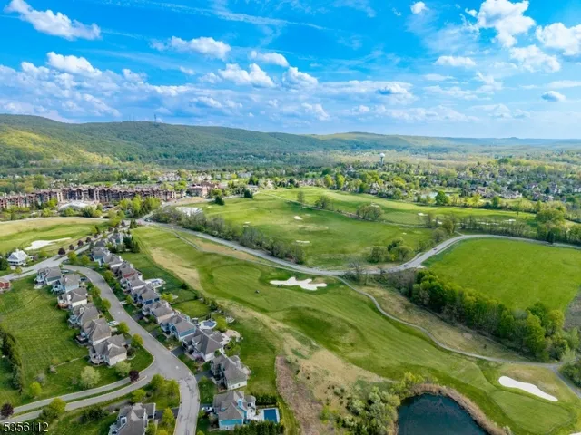 a view of a city with a lake
