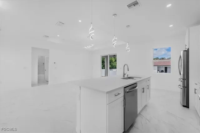 a kitchen with a sink and cabinets