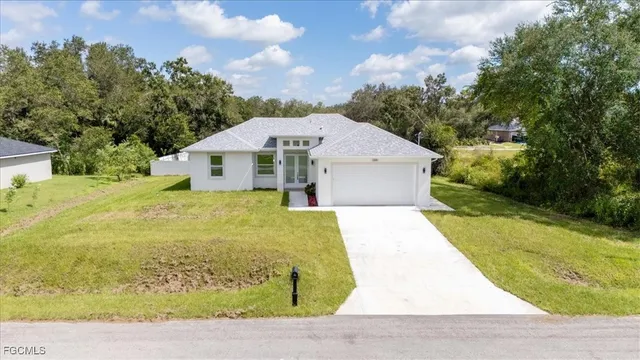 a view of a yard with swimming pool