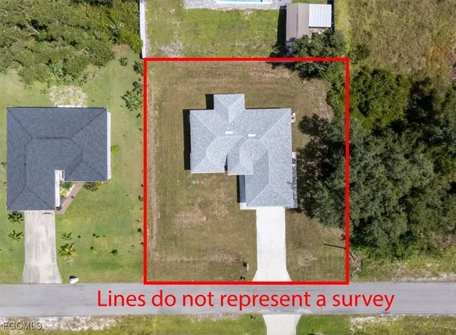 an aerial view of a house with swimming pool and mountains