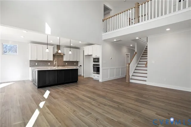 a view of kitchen with wooden floor and windows