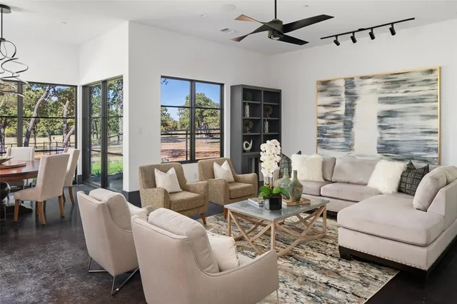 a living room with furniture and a large window