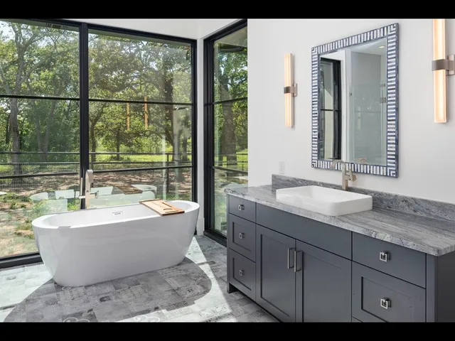 a spacious bathroom with a bathtub and sink