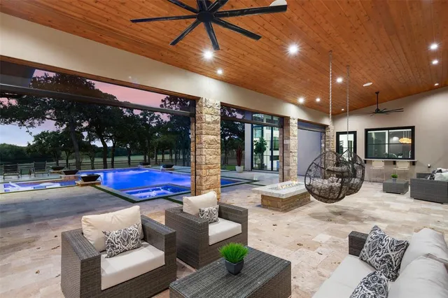 a view of a livingroom with couch and dining table