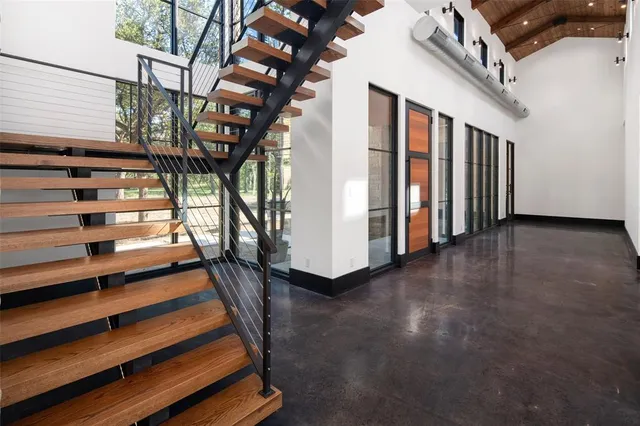 a kitchen with stove a sink and a refrigerator