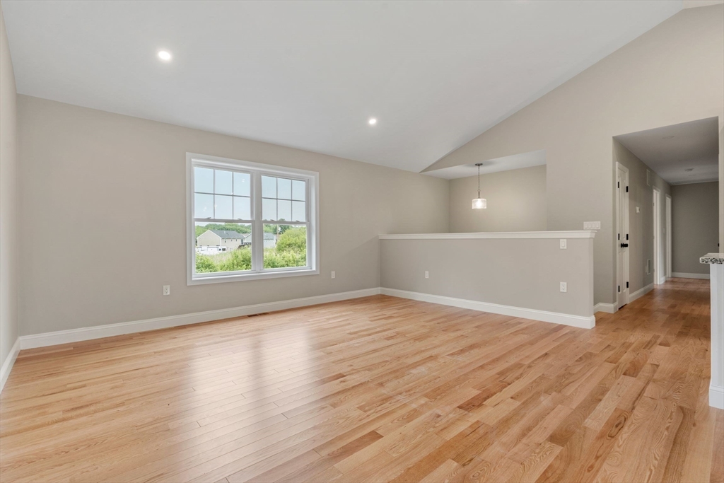 4 Bronson Street Fall River, MA 02721 - Photo 13 of 21 wooden floor in an empty room with a window
