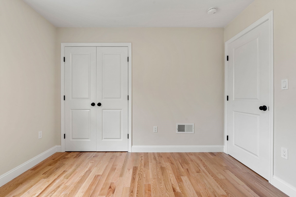 4 Bronson Street Fall River, MA 02721 - Photo 18 of 21 a view of an empty room with wooden floor