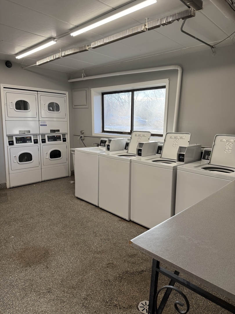 138 East Bailey Road, Unit B Naperville, IL 60565 - Photo 17 of 20 a large white building with glass windows