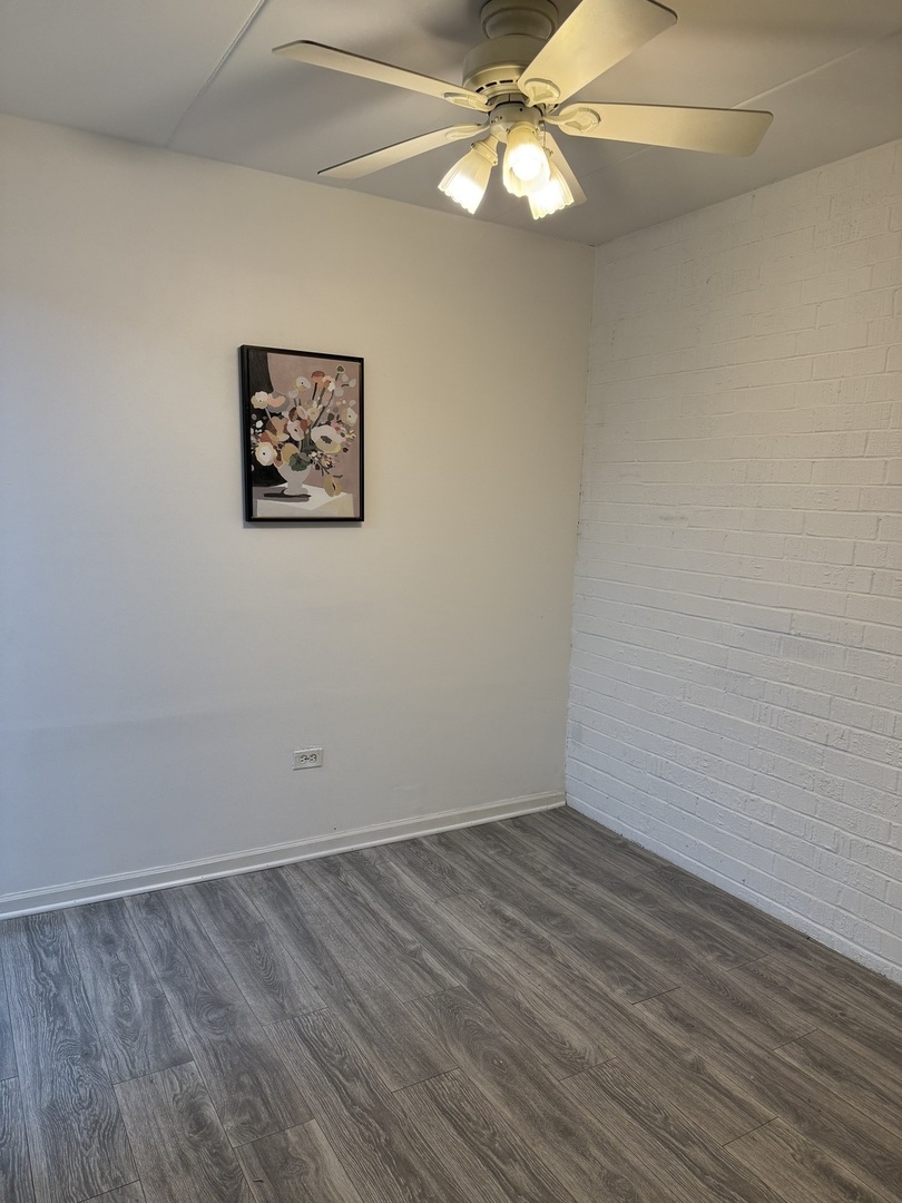 138 East Bailey Road, Unit B Naperville, IL 60565 - Photo 6 of 20 wooden floor in a empty room