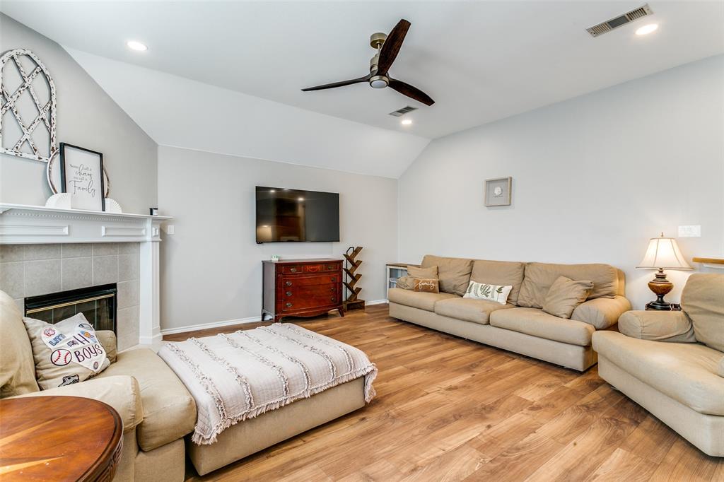 2724 Windstone Way Corinth, TX 76210 - Photo 11 of 24 Living space open to kitchne and dining area.