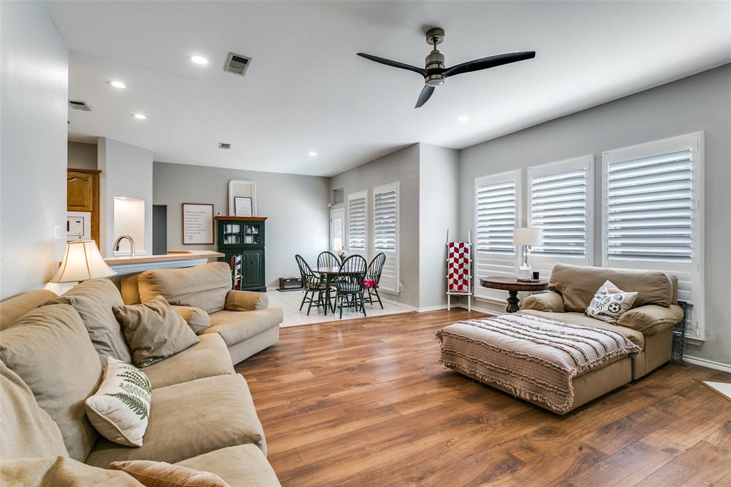 2724 Windstone Way Corinth, TX 76210 - Photo 9 of 24 Living space open to kitchne and dining area.