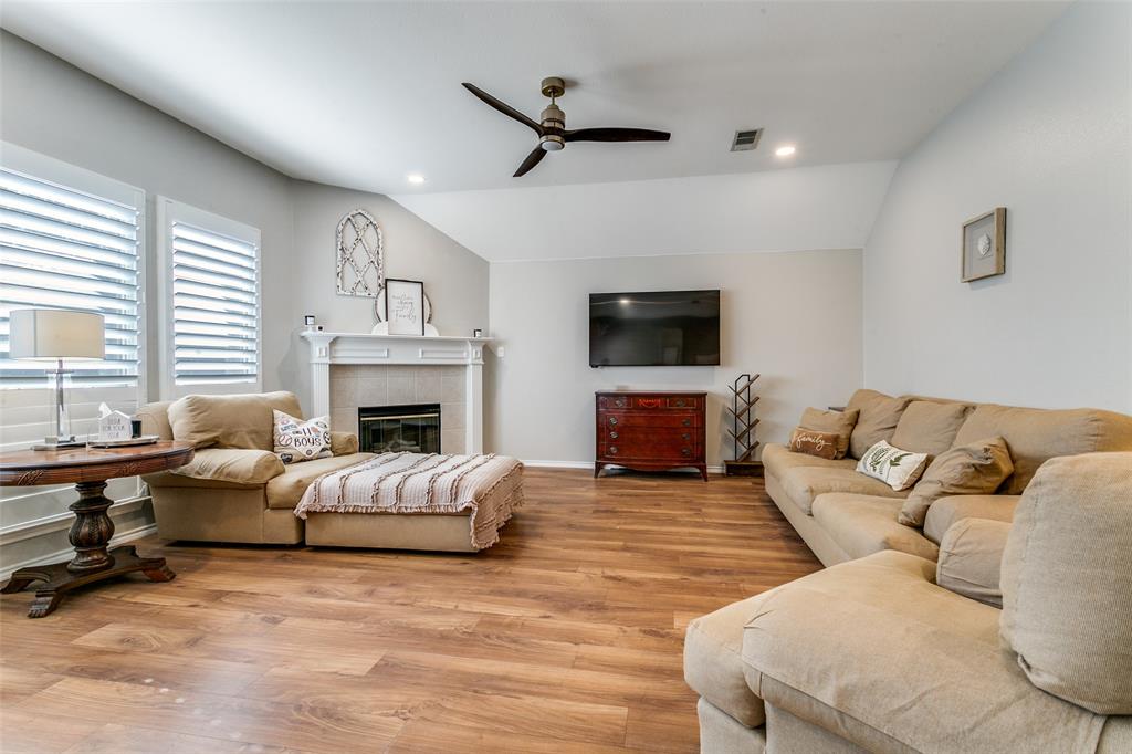2724 Windstone Way Corinth, TX 76210 - Photo 10 of 24 Living space open to kitchne and dining area.