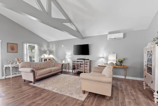 a view of a yard with wooden fence