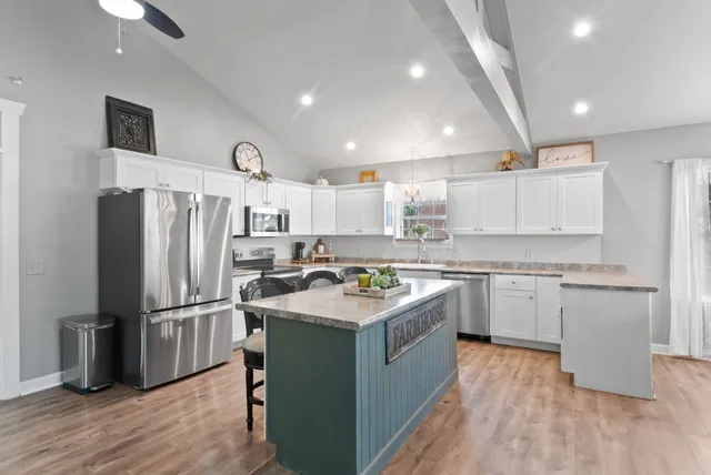 a view of outdoor space with green field and trees