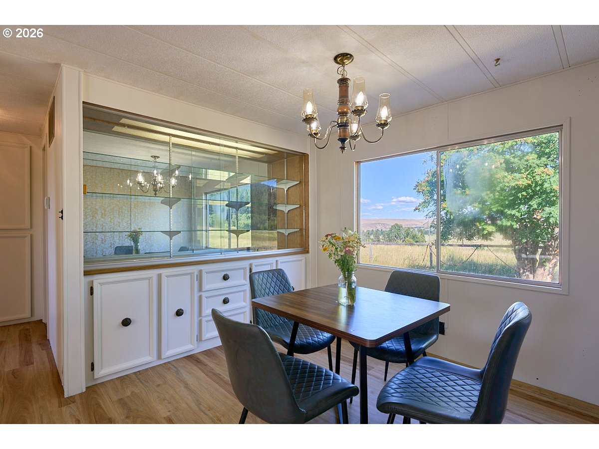 77846 Caudle Lane Lostine, OR 97857 - Photo 8 of 25 a view of a dining room with furniture window and outside view