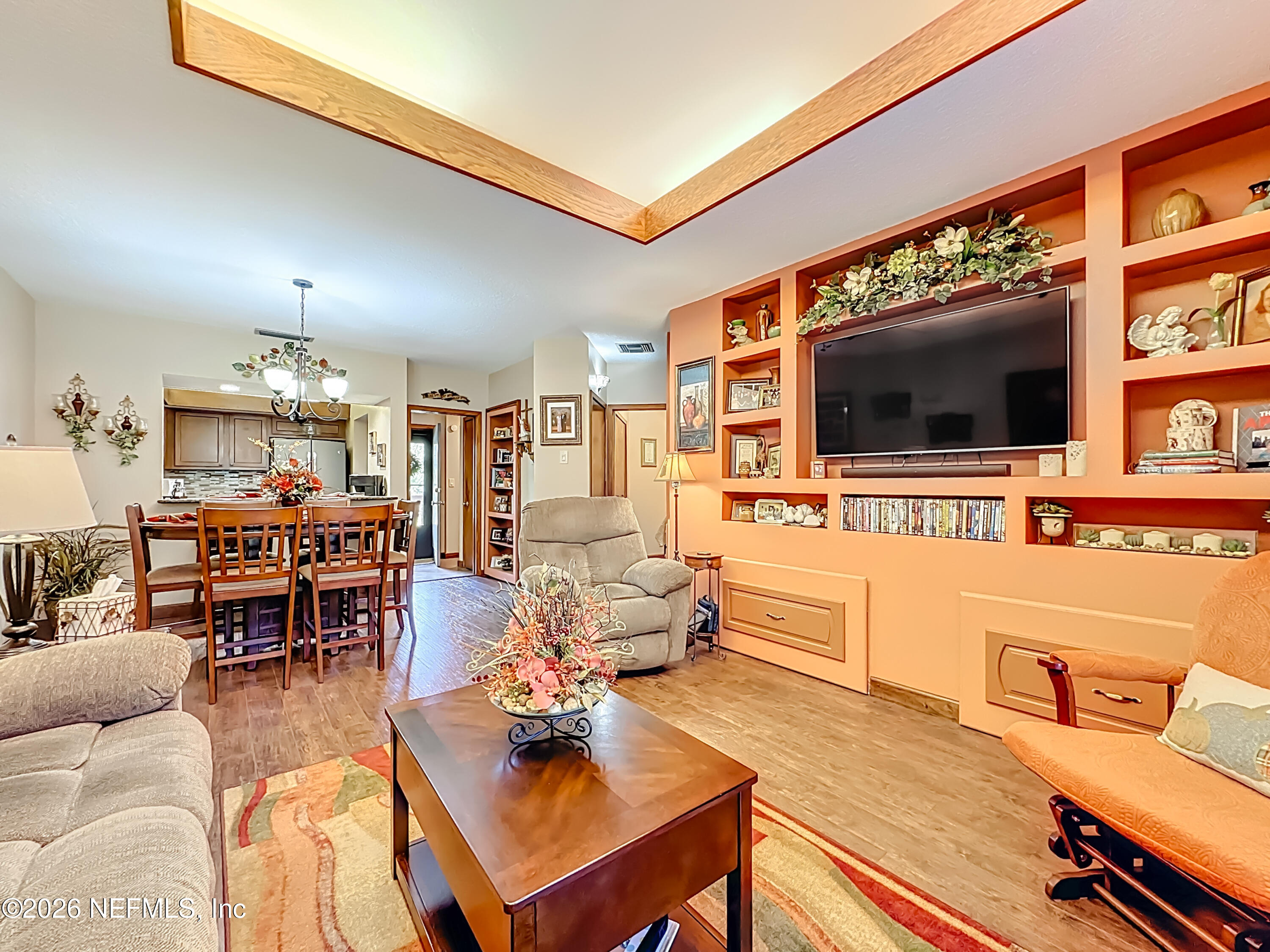 2910 Ravines Road, Unit 1103 Middleburg, FL 32068 - Photo 12 of 36 a living room with furniture and a flat screen tv