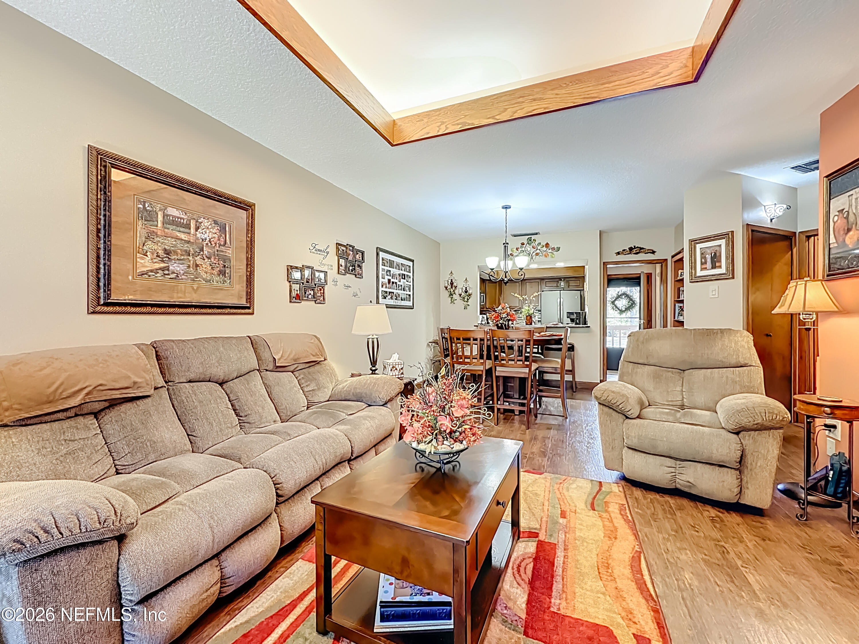 2910 Ravines Road, Unit 1103 Middleburg, FL 32068 - Photo 13 of 36 a living room with furniture and a couch