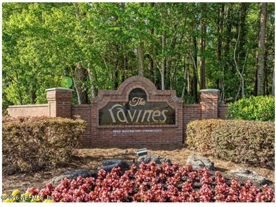 2910 Ravines Road, Unit 1103 Middleburg, FL 32068 - Photo 2 of 36 a view of a park with plants and large trees