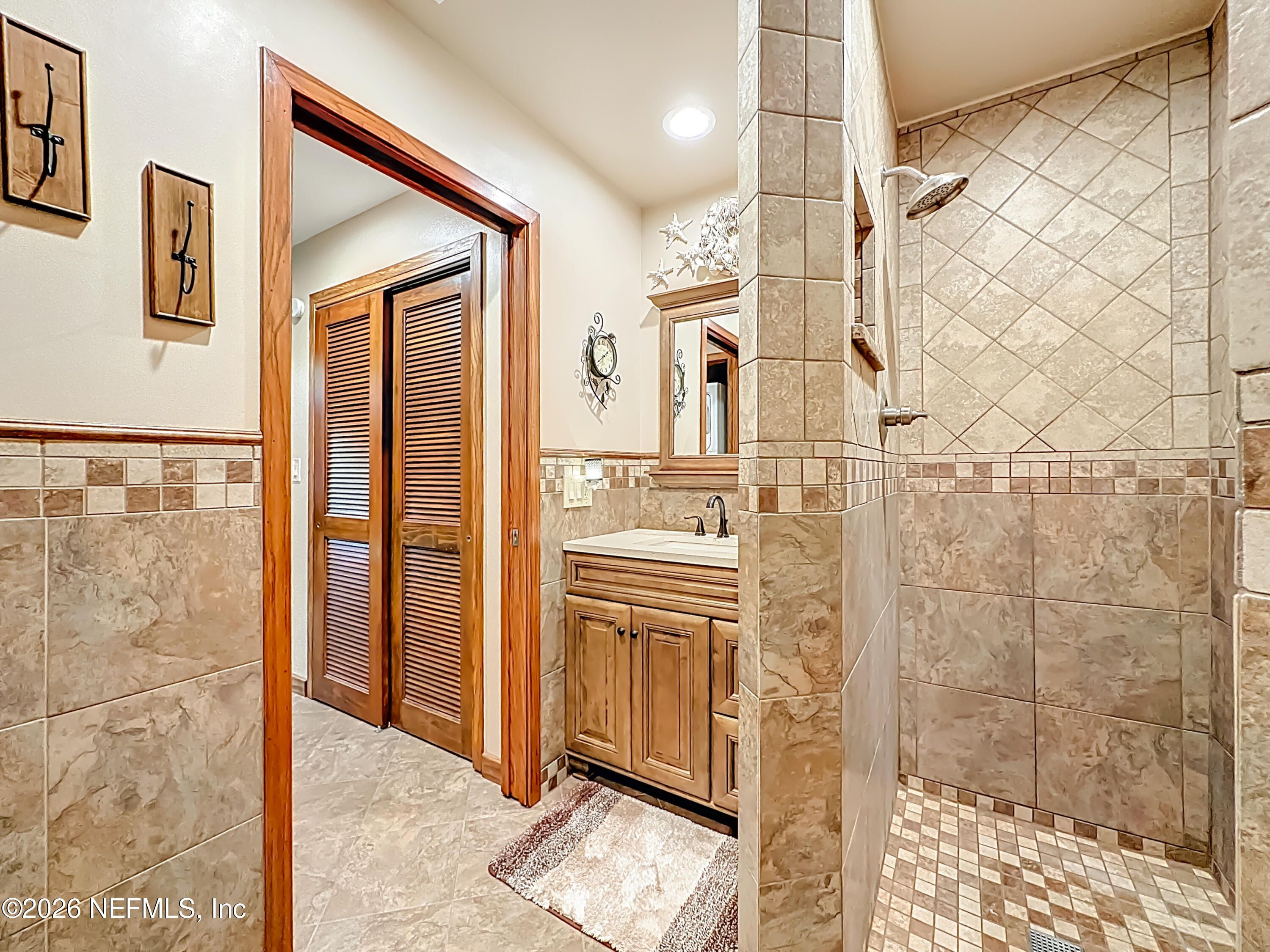 2910 Ravines Road, Unit 1103 Middleburg, FL 32068 - Photo 27 of 36 a bathroom with a shower