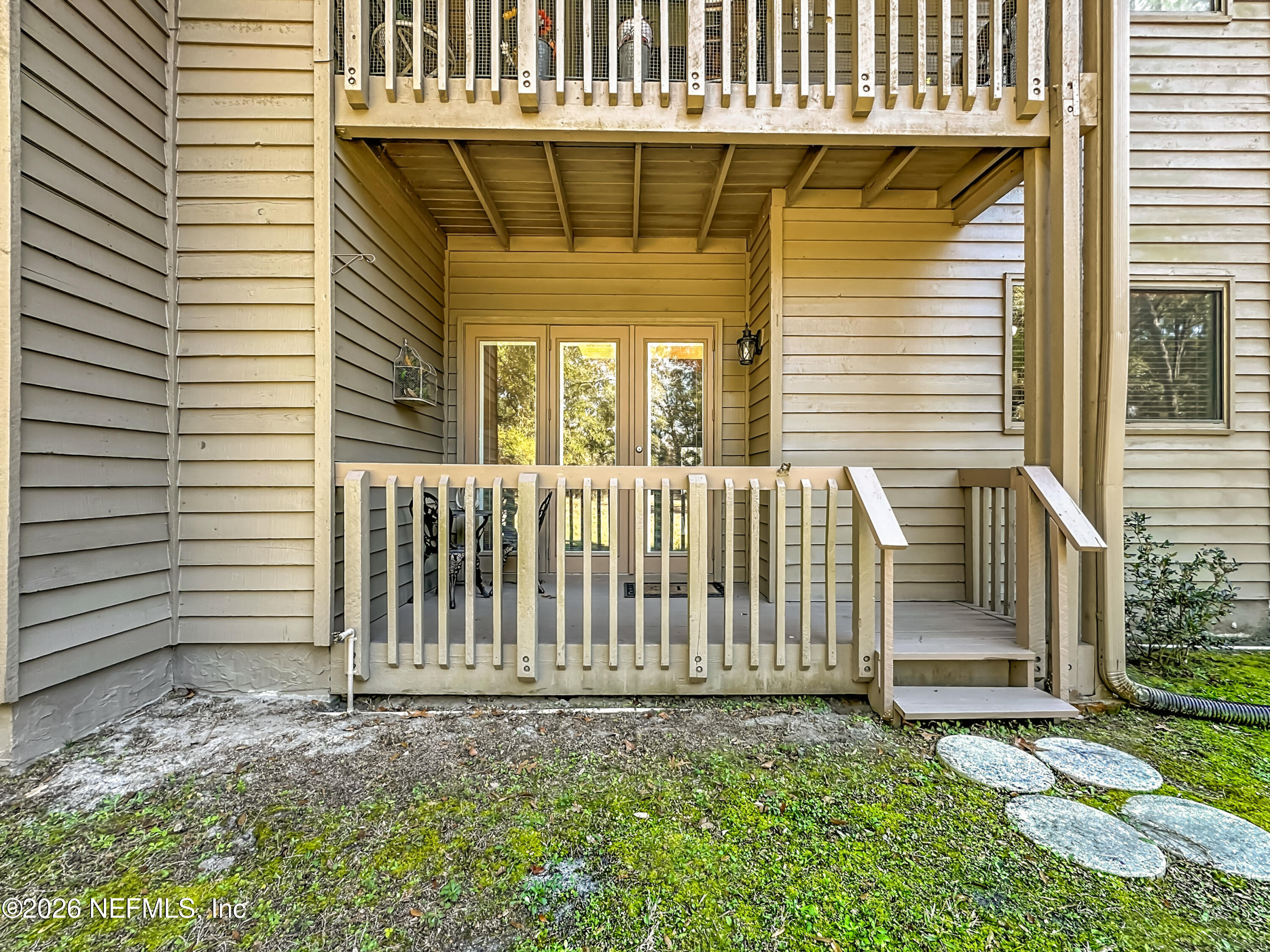 2910 Ravines Road, Unit 1103 Middleburg, FL 32068 - Photo 32 of 36 a view of a house with a small yard and wooden floor and fence