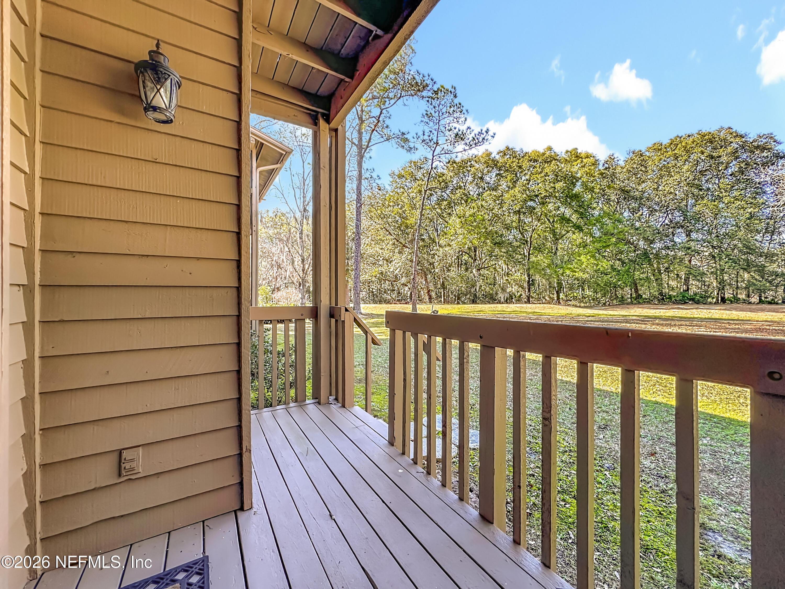 2910 Ravines Road, Unit 1103 Middleburg, FL 32068 - Photo 34 of 36 a view of a balcony with wooden floor
