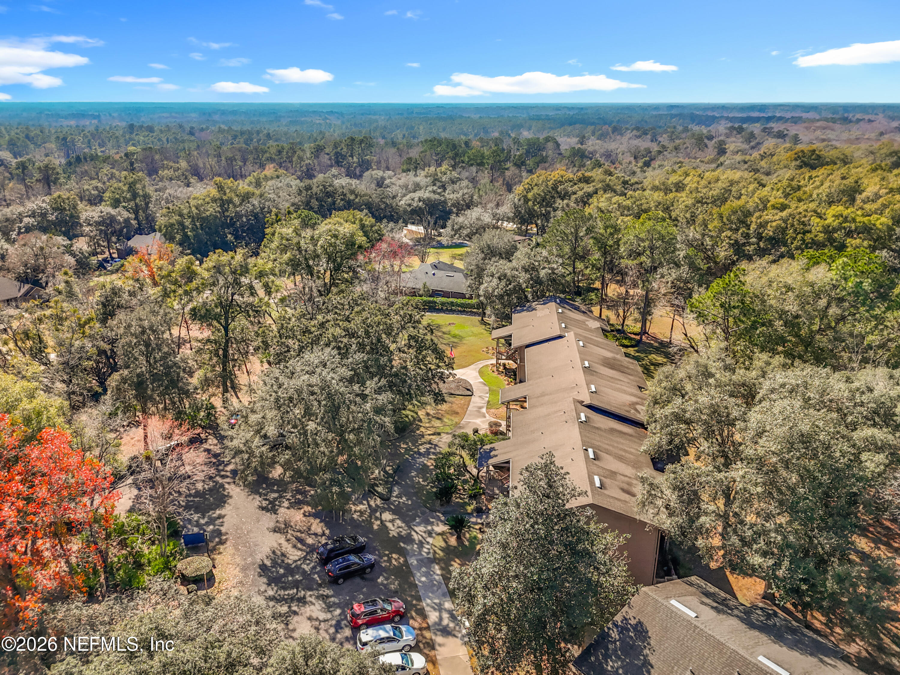 2910 Ravines Road, Unit 1103 Middleburg, FL 32068 - Photo 35 of 36 an aerial view of residential building with parking space