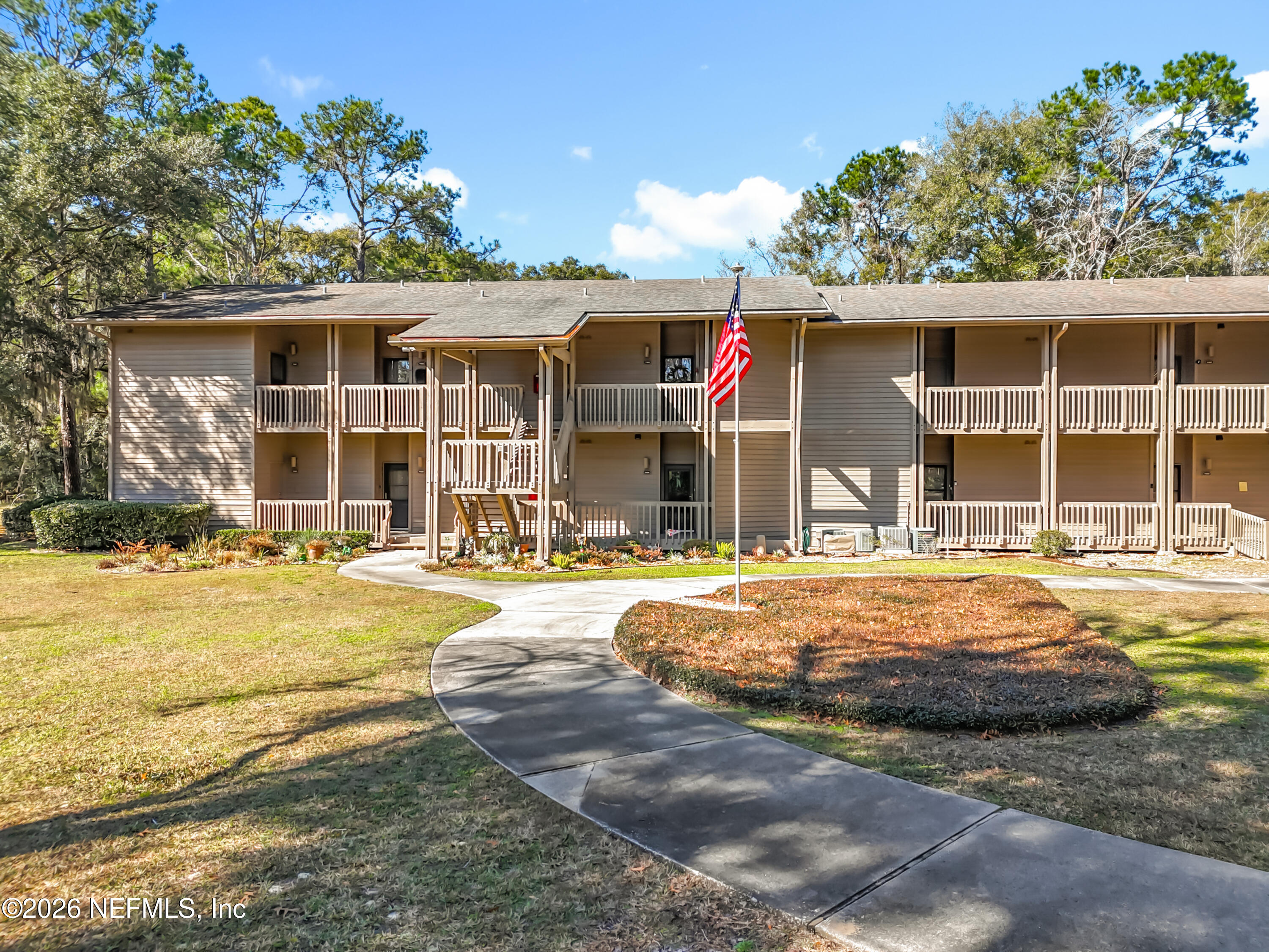 2910 Ravines Road, Unit 1103 Middleburg, FL 32068 - Photo 5 of 36 a front view of a house with swimming pool