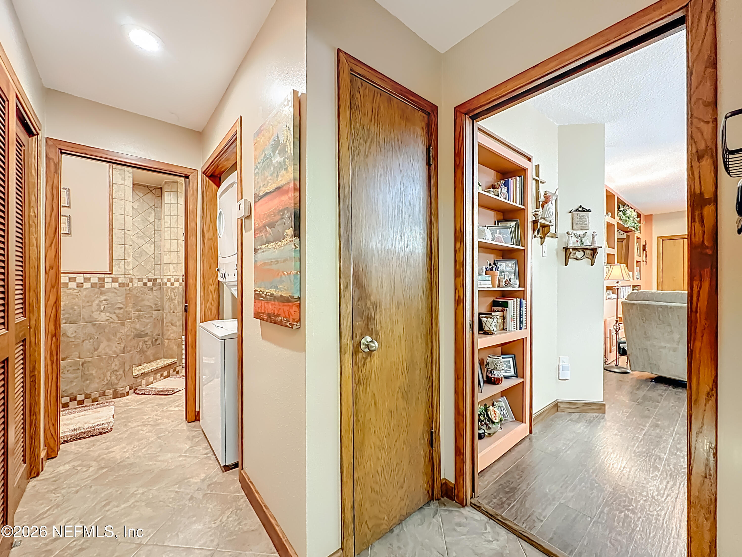 2910 Ravines Road, Unit 1103 Middleburg, FL 32068 - Photo 9 of 36 a view of a hallway with wooden floor and windows