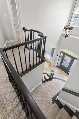 a view of a balcony with furniture and wooden floor
