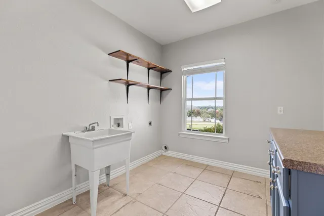 a view of room with window and hallway