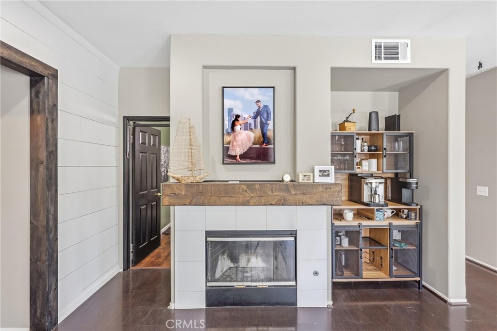8402 Lindenhurst Street Riverside, CA 92508 - Photo 13 of 60 a living room with furniture and a fireplace