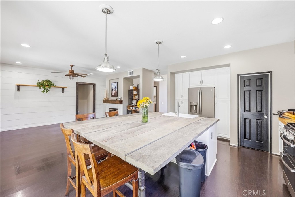 8402 Lindenhurst Street Riverside, CA 92508 - Photo 17 of 60 a dining room with furniture and wooden floor