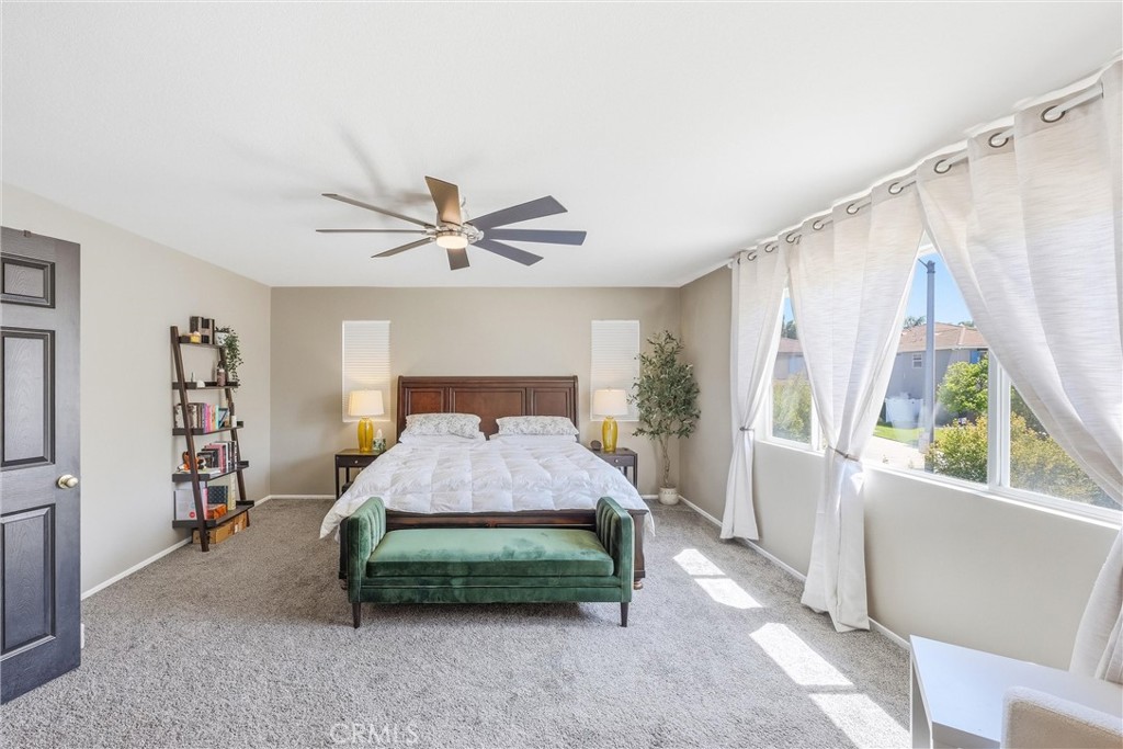 8402 Lindenhurst Street Riverside, CA 92508 - Photo 22 of 60 a bedroom with a bed and a window