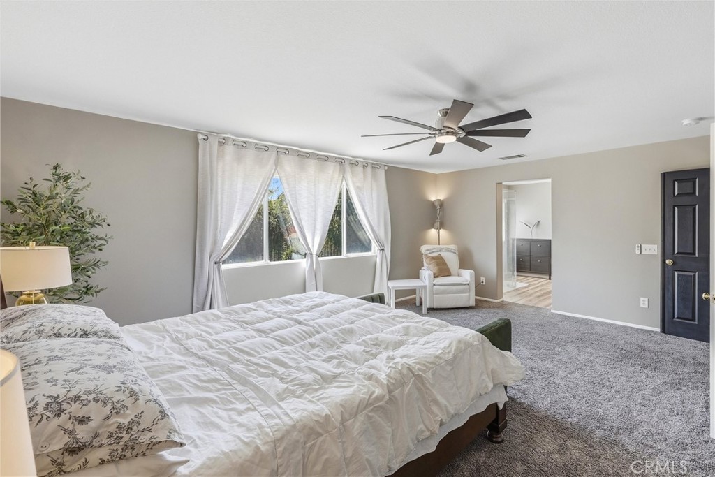 8402 Lindenhurst Street Riverside, CA 92508 - Photo 23 of 60 a bedroom with a bed and window