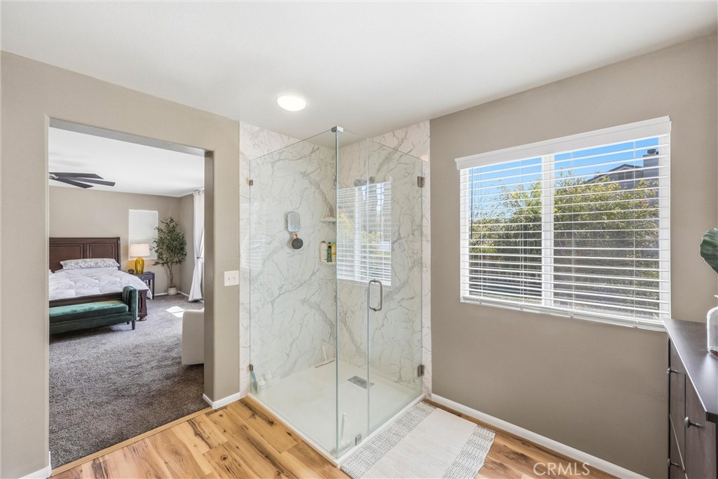 8402 Lindenhurst Street Riverside, CA 92508 - Photo 26 of 60 a view of a bedroom with a balcony and a walk in closet