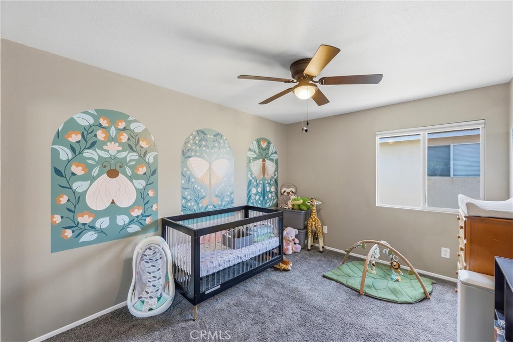 8402 Lindenhurst Street Riverside, CA 92508 - Photo 27 of 60 a bedroom with furniture and a window