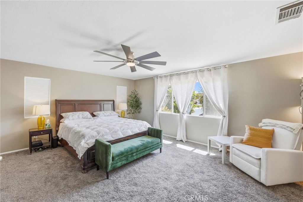 8402 Lindenhurst Street Riverside, CA 92508 - Photo 3 of 60 a bedroom with a bed and a window