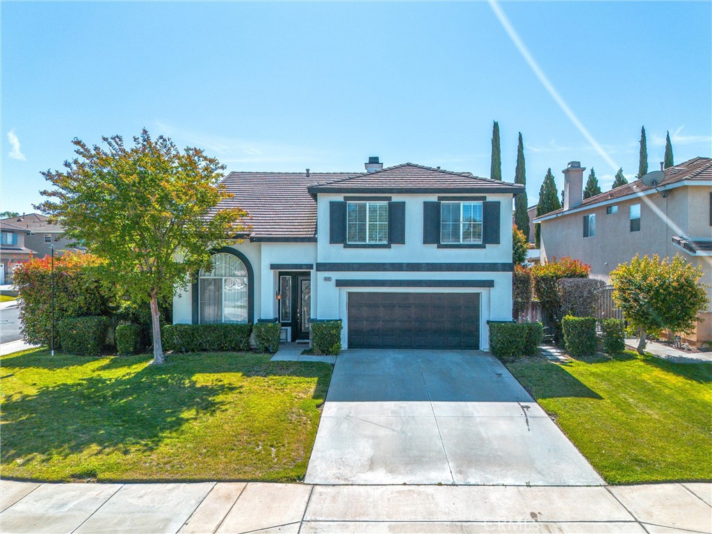 8402 Lindenhurst Street Riverside, CA 92508 - Photo 44 of 60 a front view of a house with garden