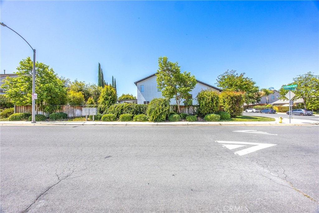 8402 Lindenhurst Street Riverside, CA 92508 - Photo 46 of 60 a view of a street with a building in front of it