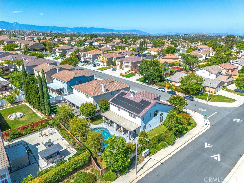 8402 Lindenhurst Street Riverside, CA 92508 - Photo 51 of 60 an aerial view of residential building with outdoor space