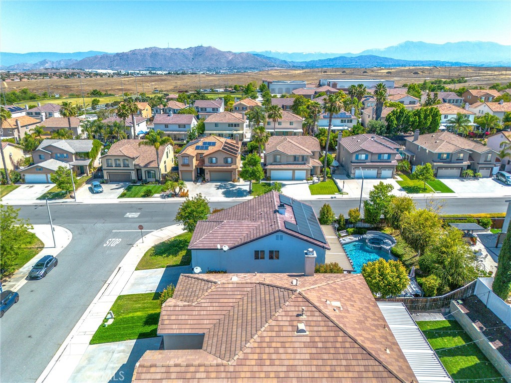 8402 Lindenhurst Street Riverside, CA 92508 - Photo 54 of 60 an aerial view of residential houses with outdoor space and ocean view