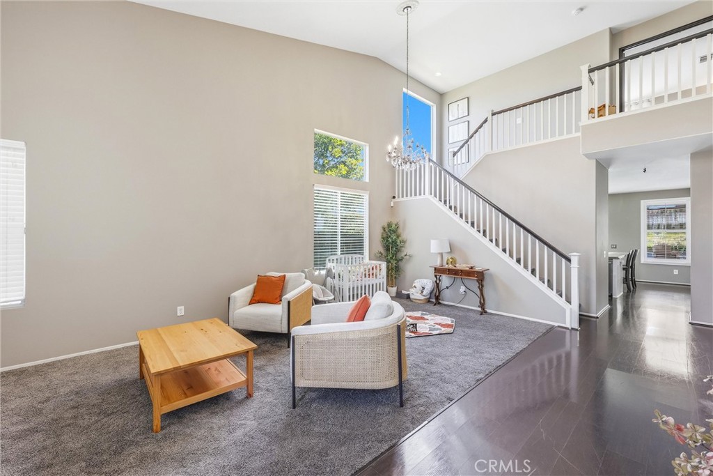 8402 Lindenhurst Street Riverside, CA 92508 - Photo 7 of 60 a living room with furniture and a potted plant