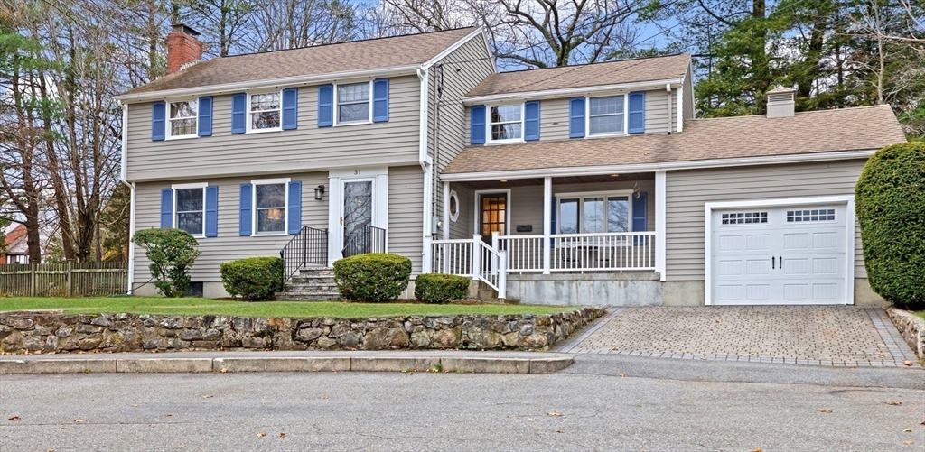 31 Doris Road Braintree, MA 02184 - Photo 18 of 20 a front view of a house with a yard and potted plants
